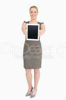 Woman standing showing an ebook screen