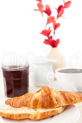Breakfast with a bisected croissant