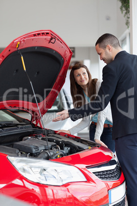 Dealer showing the car engine