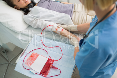 Nurse taking care of a transfused patient