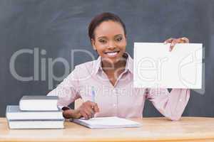 Black teacher holding a blank paper