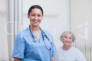 Nurse and a patient looking at camera