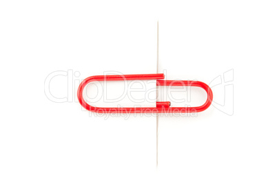 Red paperclip paperclip attaching on paper