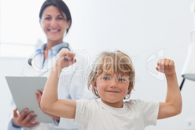 Happy child next to a doctor