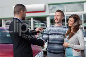 Man shaking hand with salesman