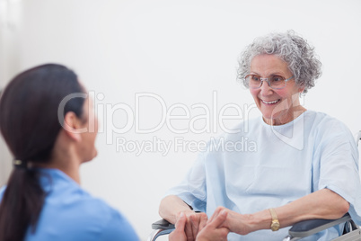 Nurse holding hands of a patient
