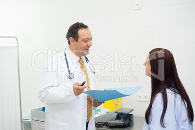 Doctor and patient talking together