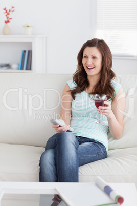 Smiling woman holding a glass of wine