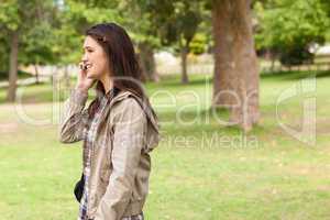 Side view of a teenager phoning