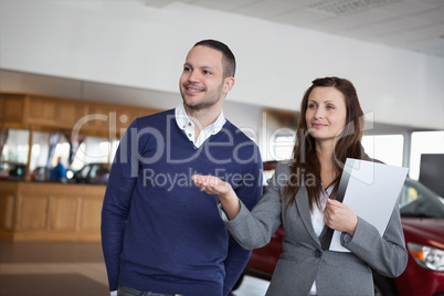 Woman showing something to a man