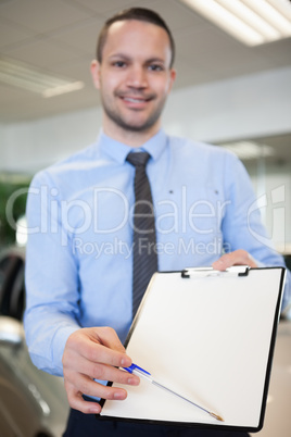 Salesman holding a contract