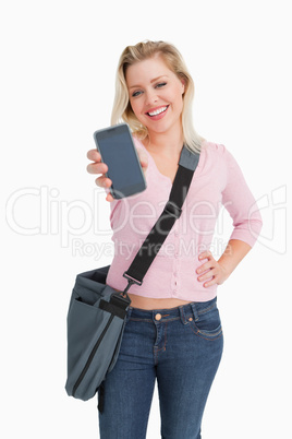 Happy blonde woman showing her smartphone