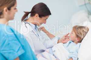 Child touching stethoscope of a doctor