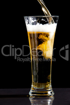 Glass being filled with beer