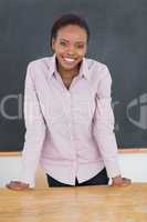 Teacher standing up while smiling