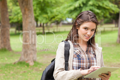 Portrait of a first-year female student using a touch pad