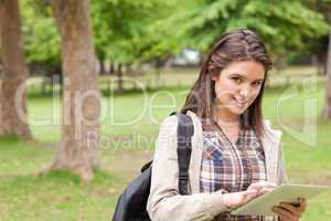 Portrait of a first-year female student using a touch pad