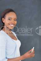 Black woman holding a chalk