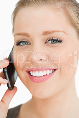 Woman smiling calling with her smartphone