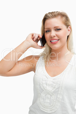 Happy blonde woman talking on the phone