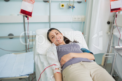 Female transfused lying on a bed