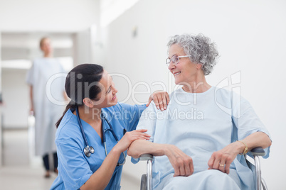 Elderly patient looking at a nurse