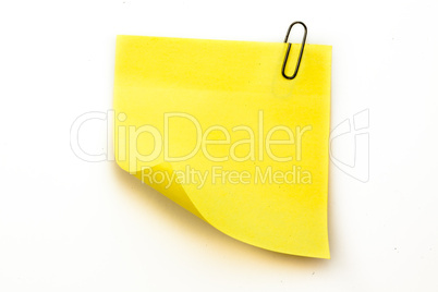 Sticky note with grey paperclip
