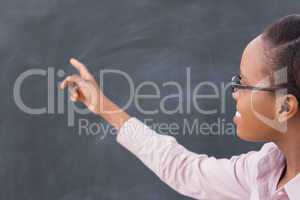 Black teacher pointing the blackboard