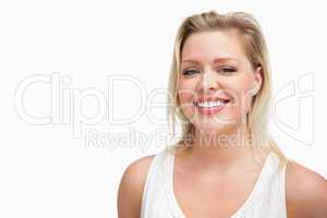 Cheerful blonde woman standing upright
