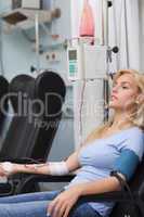 Blonde patient receiving a blood transfusion