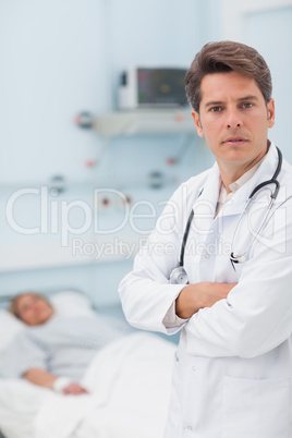 Doctor crossing arms while standing