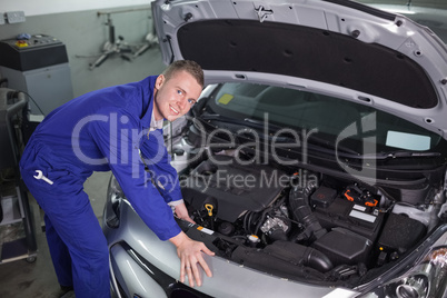 Mechanic repairing an engine of car