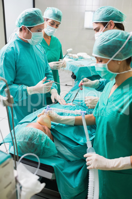 Nurse holding an oxygen mask of patient