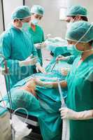 Nurse holding an oxygen mask of patient