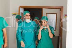 Surgery team leaving the operating room
