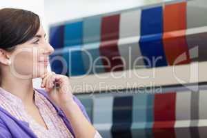 Woman smiling while wondering what color to choose