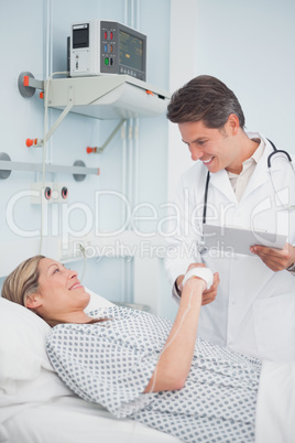Doctor smiling to his patient