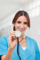 Smiling nurse holding a stethoscope