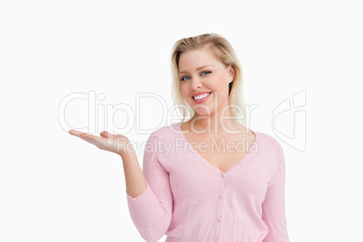 Blonde woman placing her hand palm up