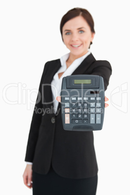 Businesswoman in black suit showing a calculator