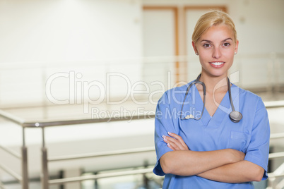 Blonde nurse looking at camera with arms crossed