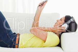 Young woman watching a video with earphones