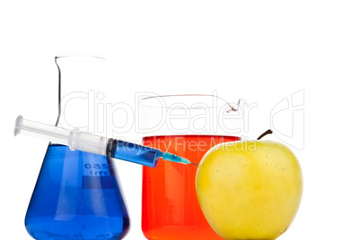 Syringe pricking an apple