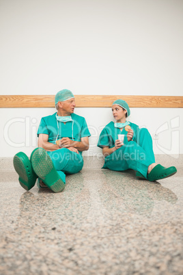 Surgeons sitting on the floor