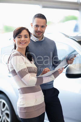 Smiling couple holding a document