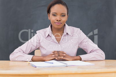 Front view of a black teacher looking at camera