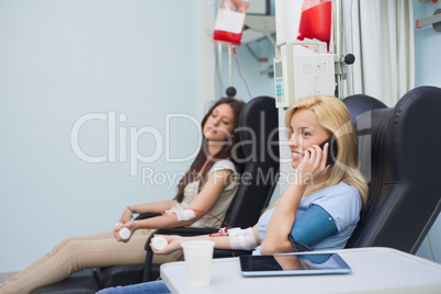 Patient receiving a blood transfusion while calling