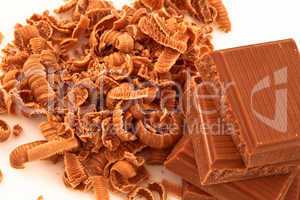Chocolate shavings surrounding a pile of chocolate