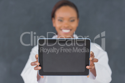 Focus on a black woman holding an ebook