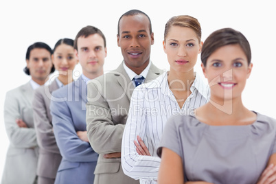 Big close-up of a business team in a single line crossing their